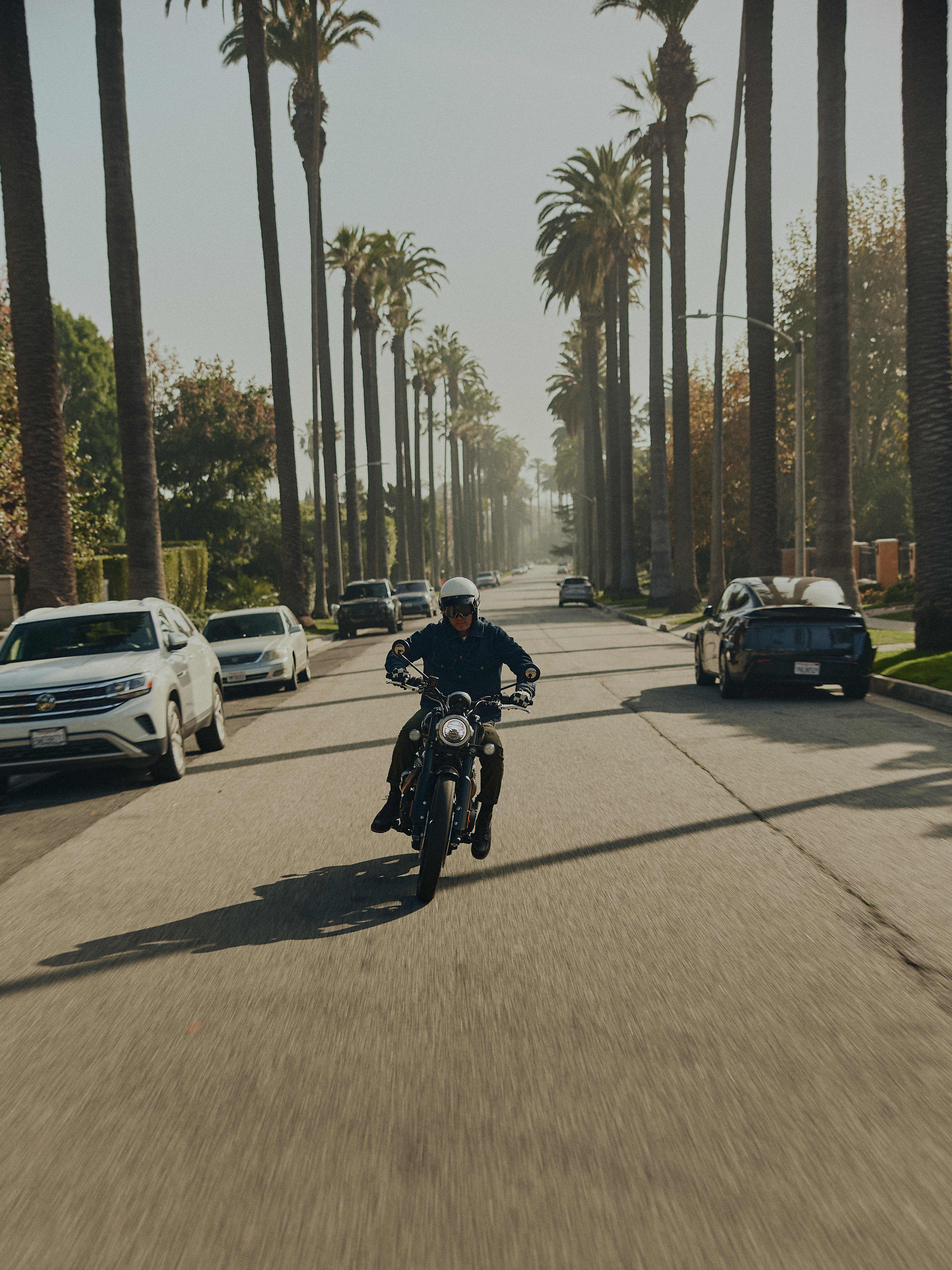 Man riding on Triumph Motorbike wearing Triumph Jacket