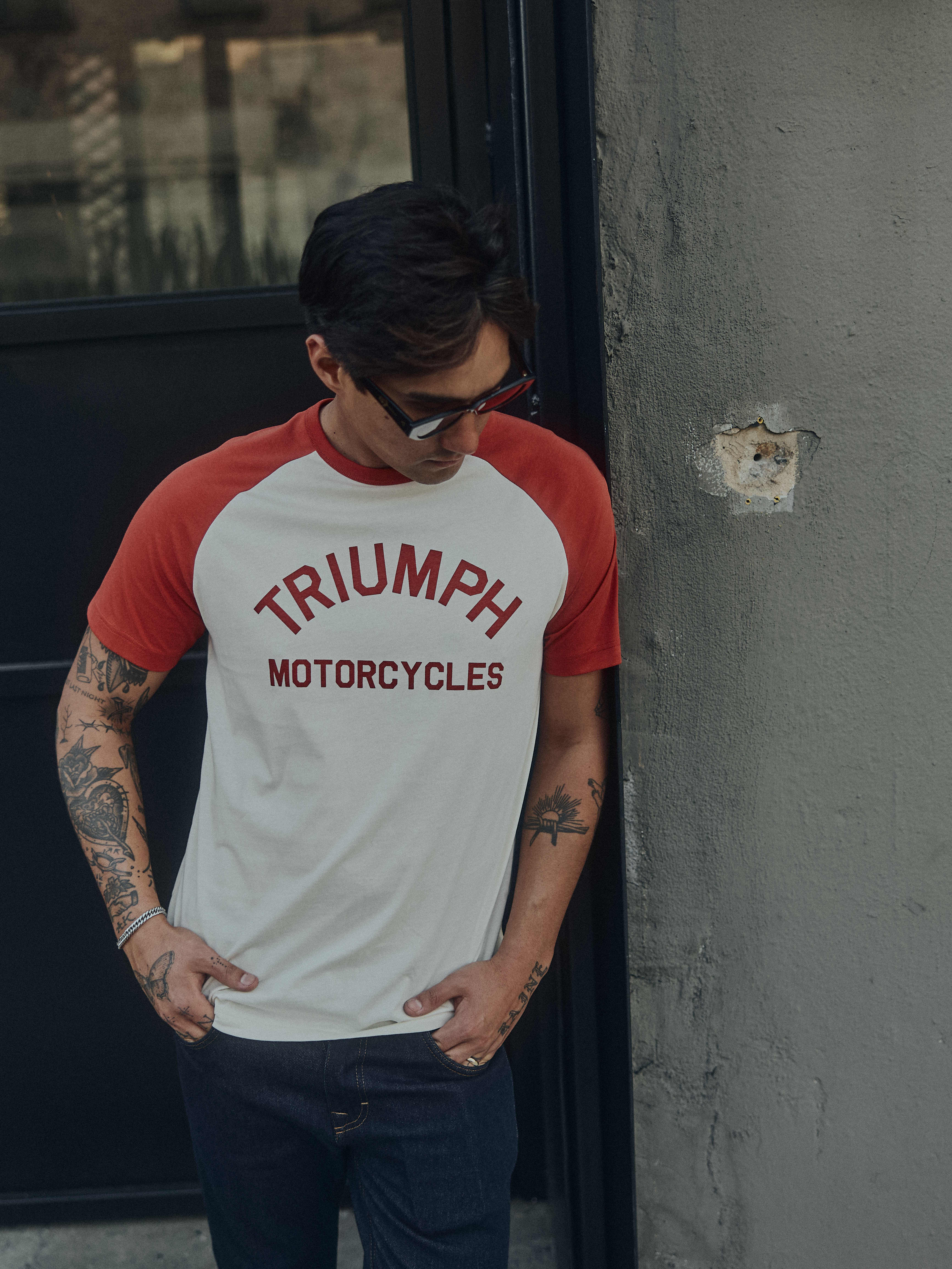 Man on a motorcycle wearing a Triumph Motorcycle T-shirt