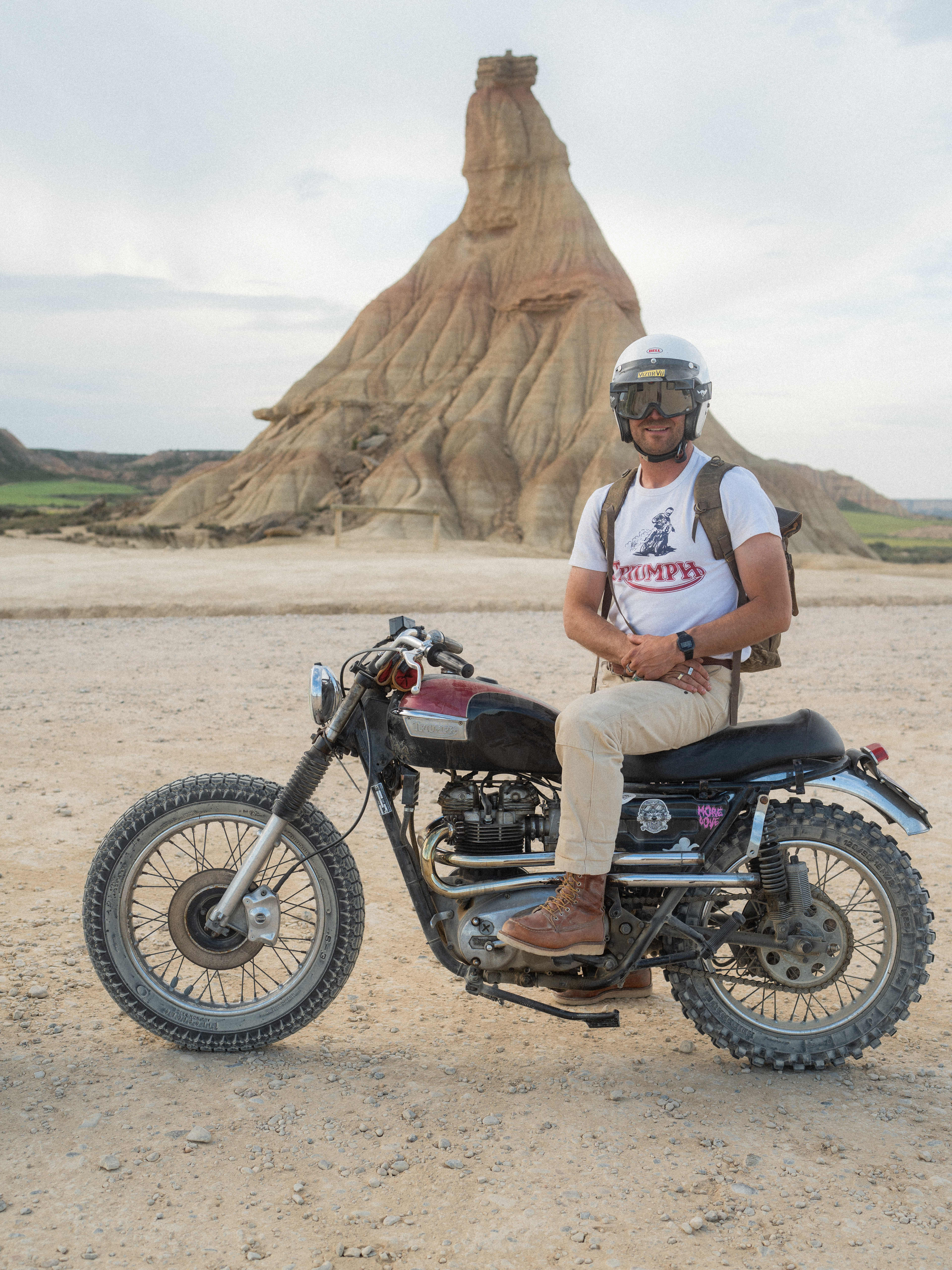 Man sat on motorbike wearing Triumph Heritage