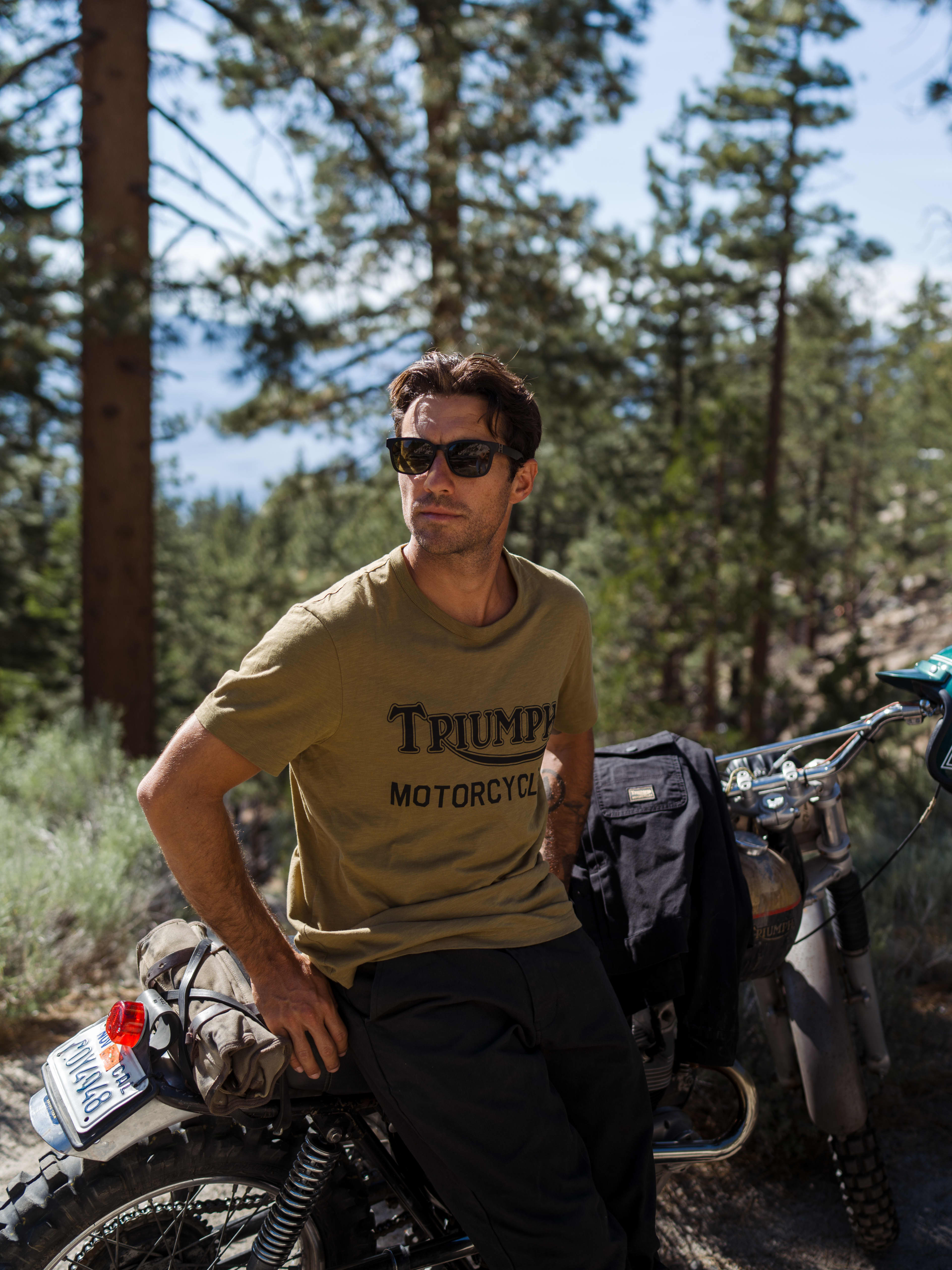Man sat on motorbike wearing Triumph Heritage