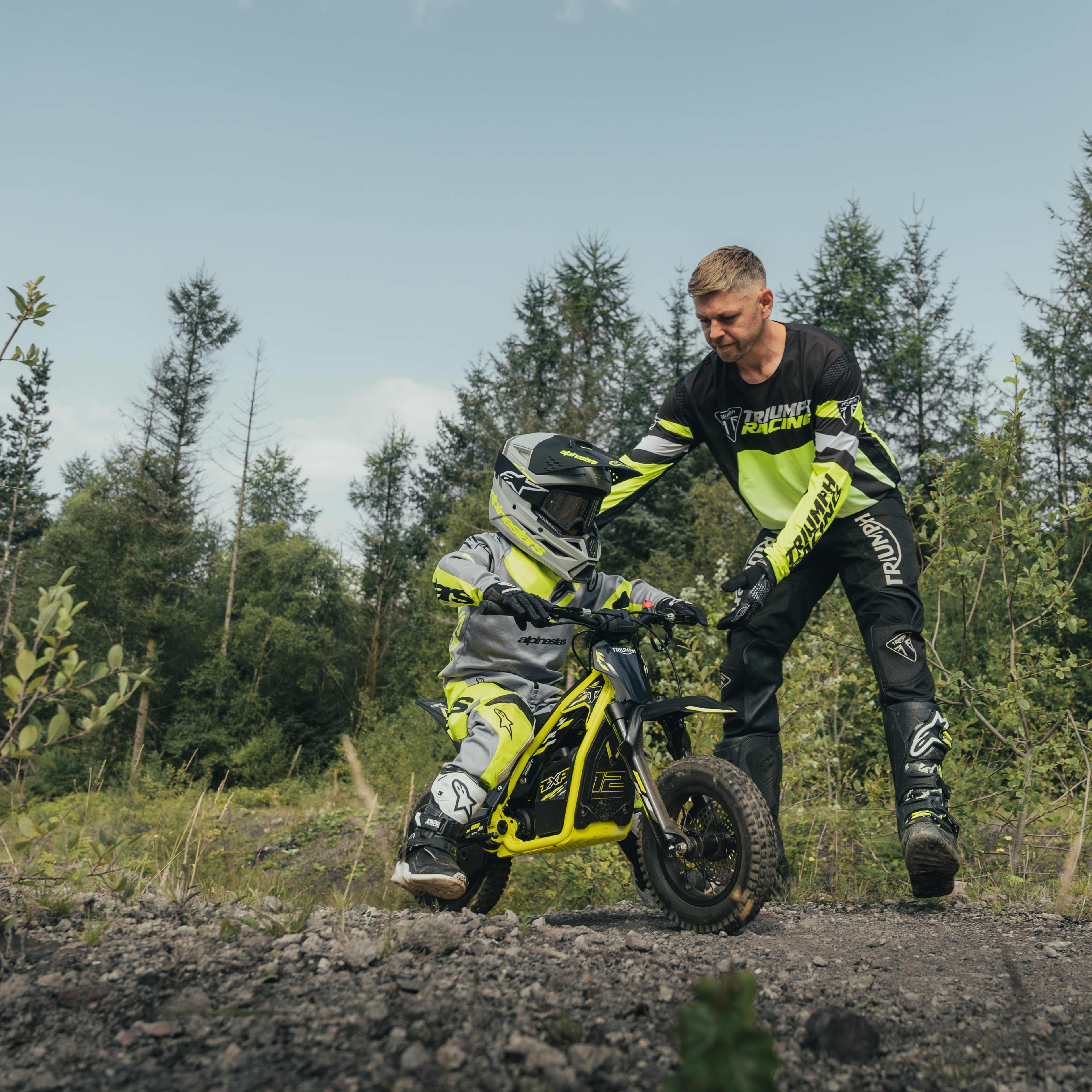 Purpose-built for every stage Young rider on the Triumph TXP-12 powered by OSET bike with adult supervision.