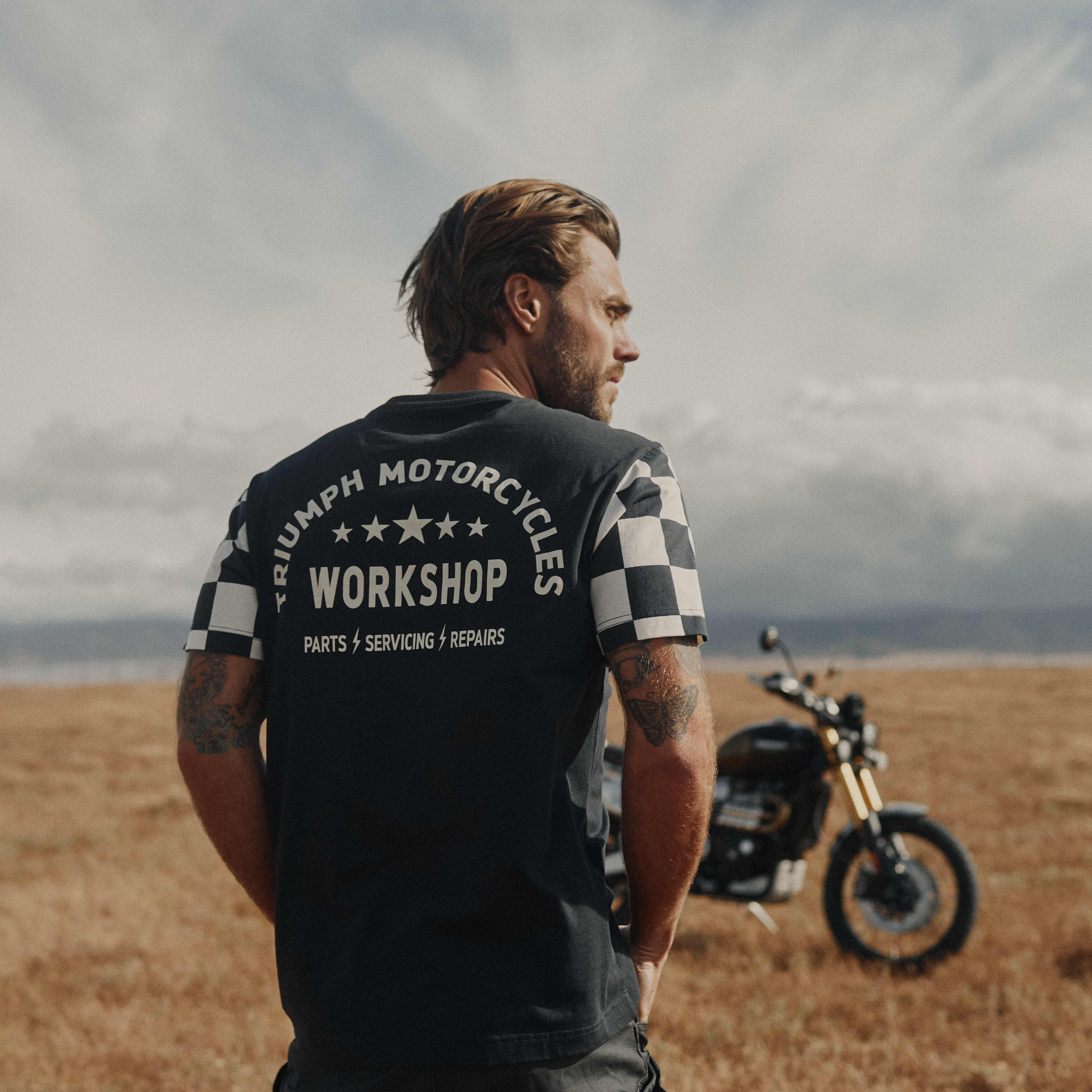 Man on a motorcycle wearing a Triumph Motorcycle T-shirt