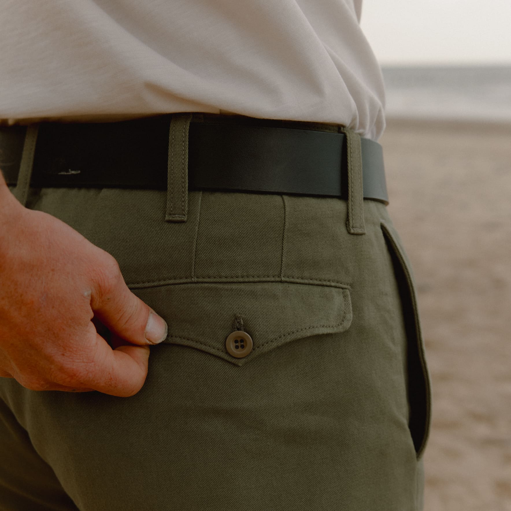 Close up of green chinos back pocket