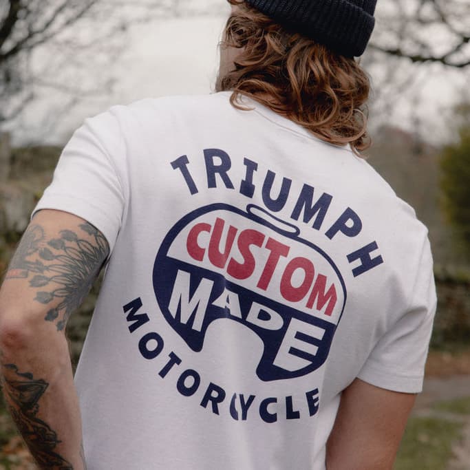 Man in white t-shirt with Triumph ' Custom Made' Motorcycles