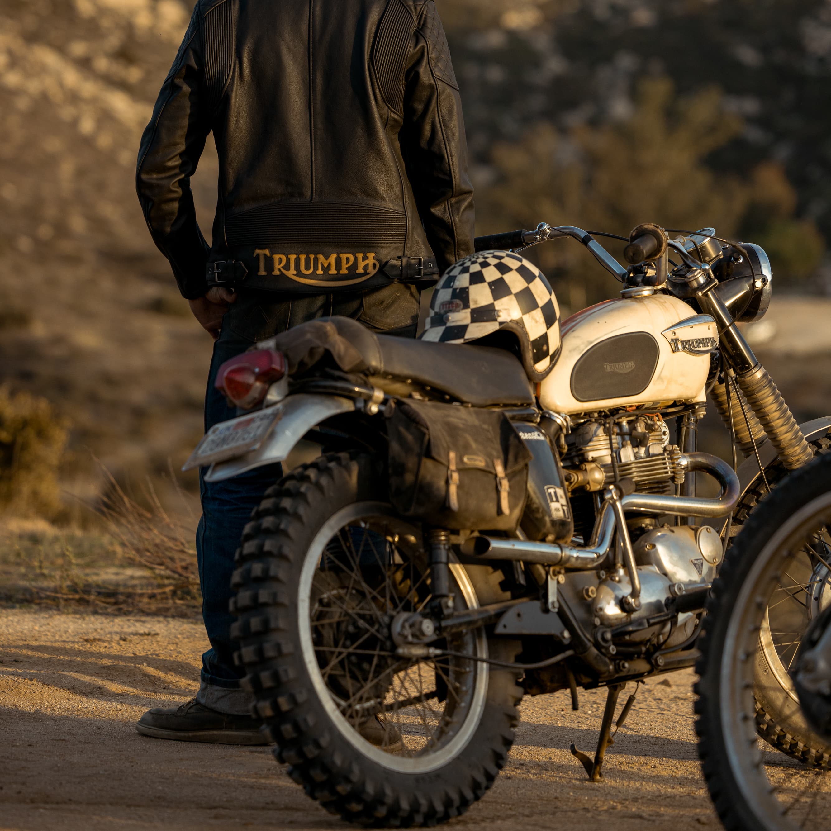 Man looking in the distance wearing a Triumph Heritage Jacket