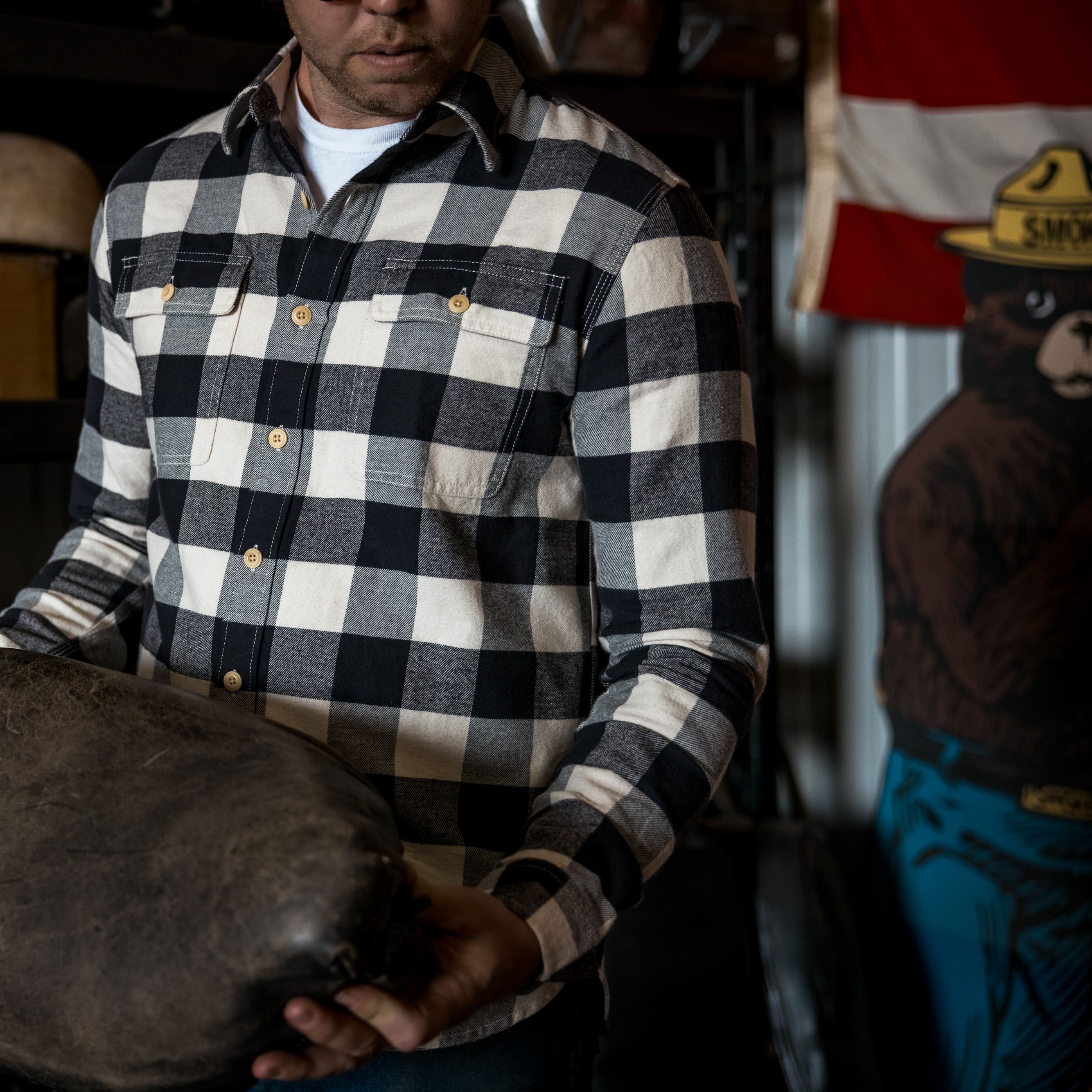 Close up of man wearing checker white and black shirt