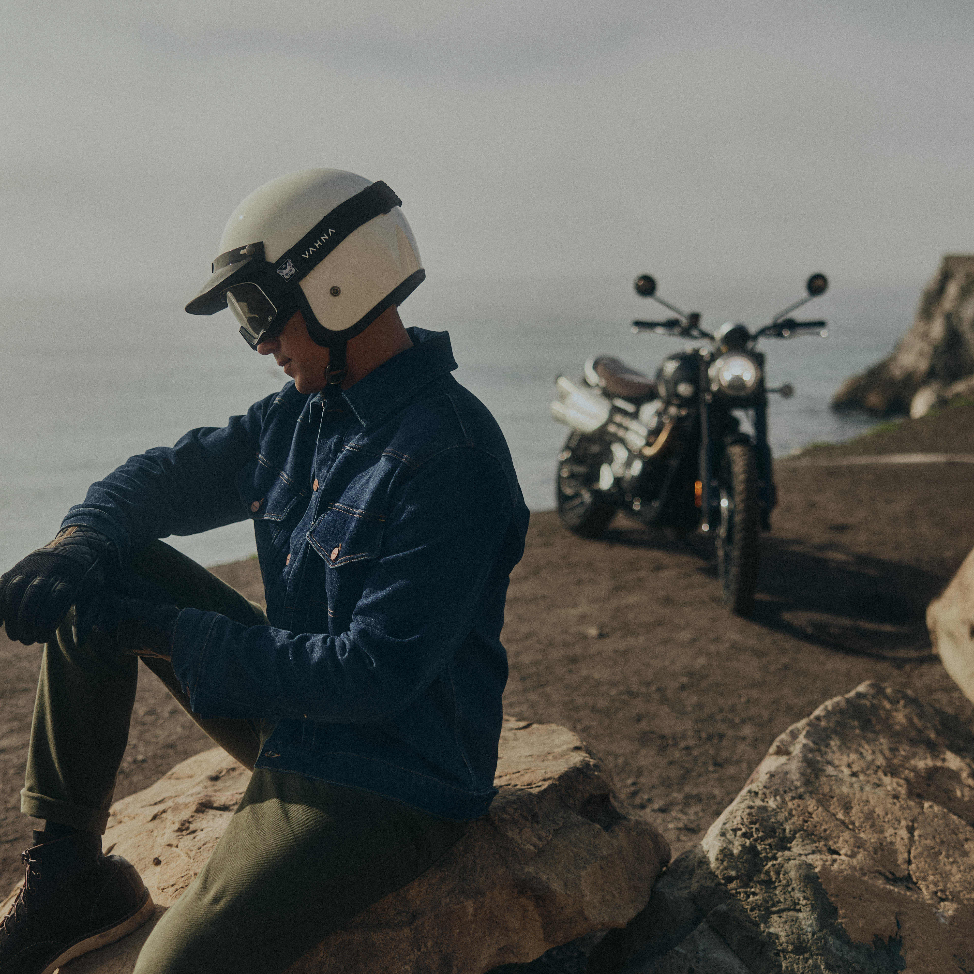 Man sat wearing Triumph Jax Denim Jacket and Hopper Denim Jeans