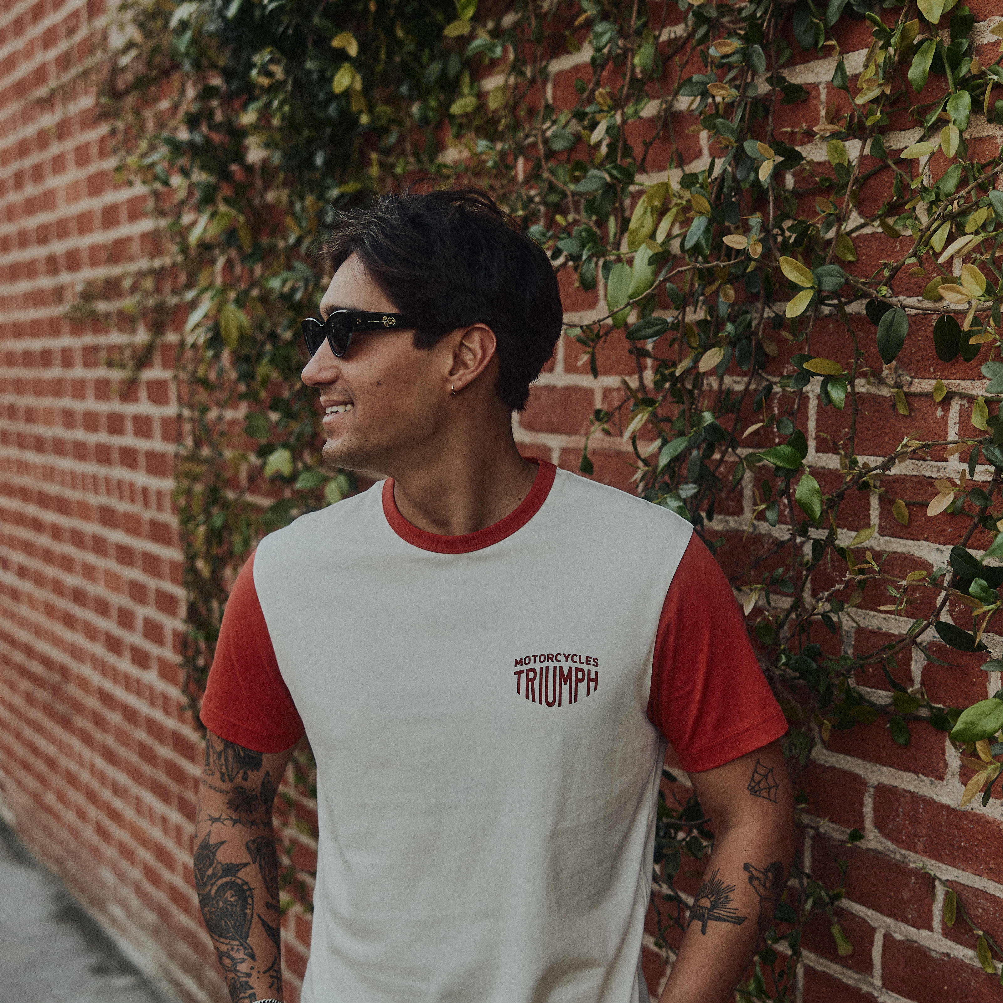 Man in the street wearing a Triumph T-Shirt