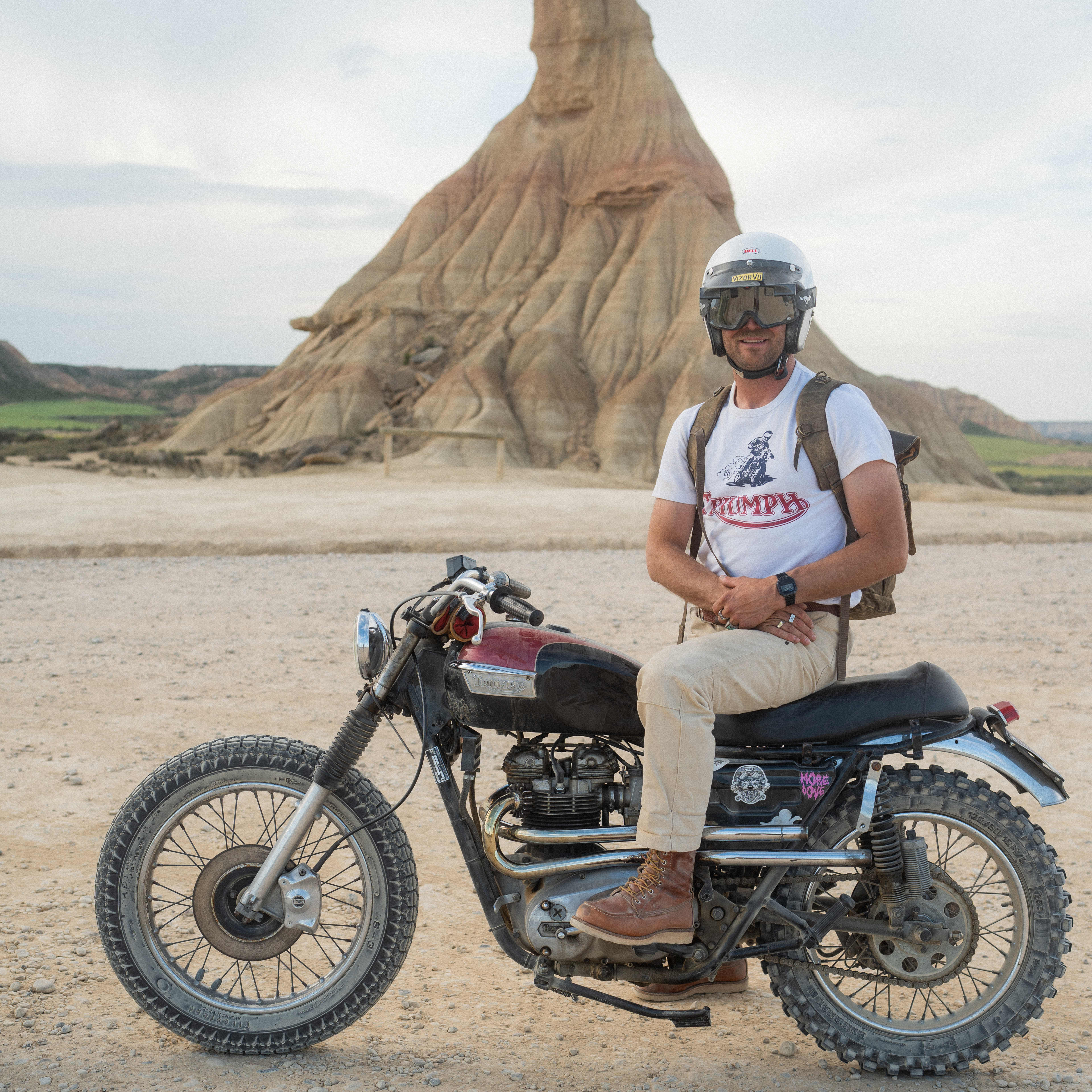 Man sat on motorbike wearing Triumph Heritage